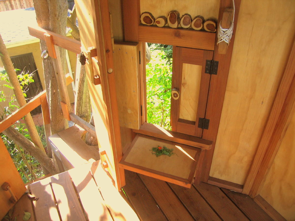 Redwood TreeYurt, closeup view, doors open and bucket shelf up