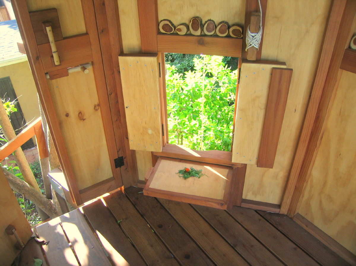 Tree Yurt treehouse, note: the custom wooden bucket shelf in UP position (to support bucket)